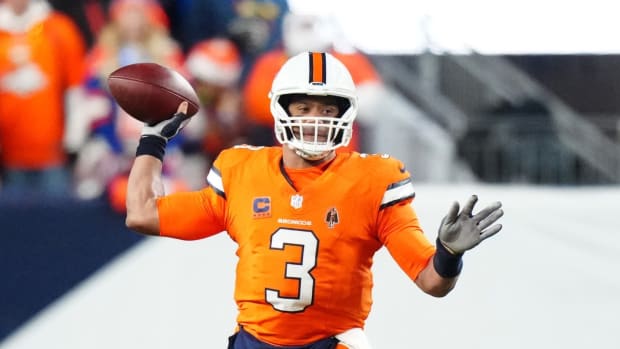 Dec 24, 2023; Denver, Colorado, USA; Denver Broncos quarterback Russell Wilson (3) prepares to pass in the first half against the New England Patriots at Empower Field at Mile High.